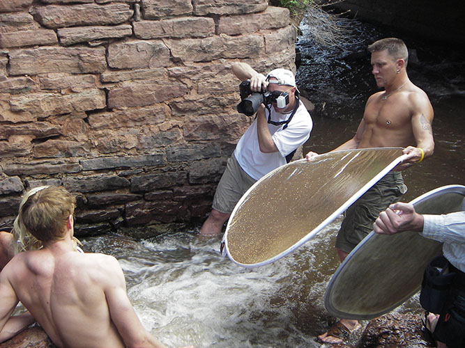 Brody Hall photographing two models in Tennessee stream