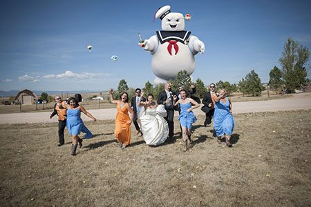 bridal party running from marshmellow man bridal party running across a field, in fear, from giant marsh mellow man out in Colorado