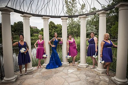 Brides maids posing in between columns Bride and bride's maids posing in between columns in Nashville