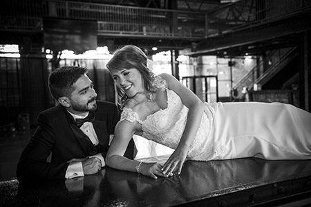 Bride and groom posing on a bar Bride and groom posing on a bar in Colorado