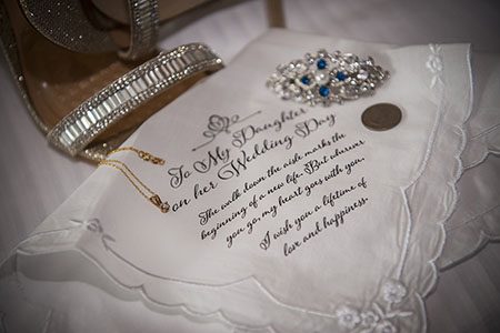 Bride shoes and brooch, on top of a personalized hand kerchief Bride shoes and brooch, on top of a personalized hand kerchief, a detail photo in Nashville