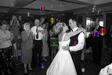 First Dance black and white image of a wedding couple dancing and the guest blowing bubbles at them in Tennessee
