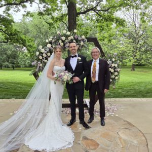 Wedding Officiant Norm McDonald standing with bride and groom at Macca Villa Event Venue, Tennessee.