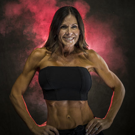 Female-fitness-competitor oiled up and slimmed down female fitness competitor taking some portrait photos before a competition in Nashville, TN