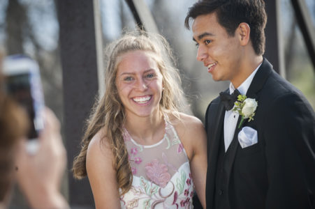 Prom-couple-taking-photos A prom couple taking photos outside at a park in Nashville